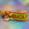 Bracelet with 'Amour' text, pink heart dangle charm