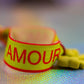 Close-up on 'Amour' text, yellow/red colors