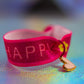 Bracelet with 'Happy' text, pink heart dangle charm