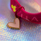 Extreme close-up of the pale pink heart charm