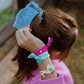 Model shot of a child wearing a mix of 'Happy' and 'Good' bracelets