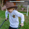 Child wearing the All Stars long sleeves T-shirt in sand