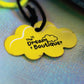 Yellow cloud-shaped Dream Boutique tag attached to the denim Allo Maman Bobo first aid kit