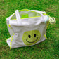 white terry bandana smiley beach bag with neon pom pom trim