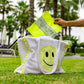 placing neon bandana pouch inside bandana smiley beach bag