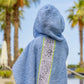 Full back view of denim blue bandana smiley poncho for kids