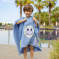 Kids denim blue bandana smiley poncho with hood by the pool