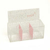 Angled view of clear glitter storage box with pink divider sections