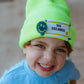 Child wearing the neon Big Dreamer beanie and making a funny face
