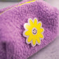smiley flower patch on purple boucle puffy pouch