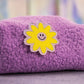 purple boucle puffy pouch with yellow smiley flower patch