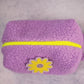 purple boucle puffy pouch with neon yellow zipper