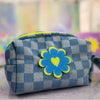 checkered denim puffy pouch with blue flower-heart patch on the front