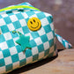 Aqua blue checkered puffy pouch showing customisable pins