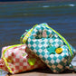 Checkered puffy pouch in aqua blue and peony pink with decorative customisable pins