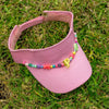 kids pink visor with colourful beaded trim and letter charm