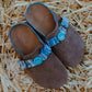Top view of cool kids bandana slip-on shoes in sky blue with smiley button and suede finish