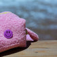 Curious Baby Pink Towel Puffy cosmetic bag with purple smiley badge