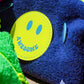 Close-up of Awesome smiley patch on Curious Deep Sea Towel Puffy cosmetic bag
