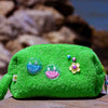 Curious Lime towel puffy cosmetic bag with smiley shaker patches and flower charm