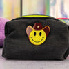 denim puffy pouch with cowboy smiley patch front angle