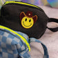 denim puffy pouch with cowboy smiley patch side view