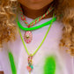 Eye See You Chain Necklace on model with neon green cord and pink eye charm