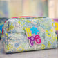 floral puffy pouch with multicolor floral print and hope patch