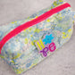 floral puffy pouch with bright pink zipper