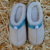 Fluffy smiley slip-on slippers top view with soft fur lining and denim trim