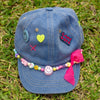 girls love denim cap with pastel beads and smiley pins on the front