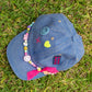 top view of girls denim cap with colourful beads and smiley embellishments
