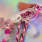 Peace sign charm detail on glitter graffiti heart key charm with braided pink rope
