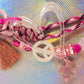 Clear bow bead with heart and star details on glitter graffiti heart key charm