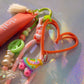 Graffiti heart key charm with orange heart clip pastel cord and roller skate charm