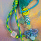 Detailed view of sky blue graffiti heart key charm beads with bow, heart and star accents
