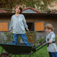Kids wearing light grey graffiti smiley long sleeve T-shirts playing together outside