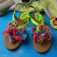neon green happy sandals with colourful fabric bows and crochet smiley accents for mums