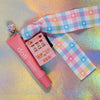 Full view of the adorable pink Mini Slot Machine accessory, shown with the pastel pink lip balm prop and the Kawaii Gingham Ribbon lanyard