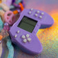Close-up of the Lilac Mini Controller Charm