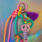 Close-up of the top half of the Graffiti Heart Key Charm, showing the bright pink clip, the large mint green heart outline, and the pastel pink peace sign bead