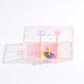 Clear peace and love themed storage box with star detail and colorful charm inside