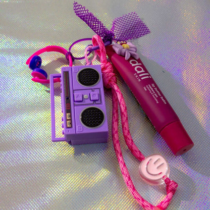 Please Don't Stop The Music key charm in purple with boombox, lip balm and smiley charm