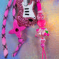 Close-up of the bottom portion, featuring the chunky pink heart, the iridescent cherry bead, and the base of the pink glitter guitar