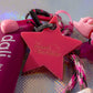 Supergirl key charm star tag with The Dream Boutique logo