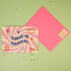 Today is magical greeting card with pastel swirl design, smiley icons and pink envelope
