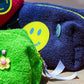 Deep Sea towel puffy cosmetic bag with smiley badge and neon zip detail