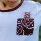 Close-up of Wilder Than The West pocket design on kids long sleeve t-shirt